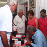 Dr Roopnarine signs copies of his book